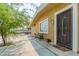 Charming front porch with security door and seating, with a tan exterior at 304 S Crestline Dr, Las Vegas, NV 89107