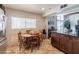 Eat-in kitchen area features a round wood table set, and breakfast bar seating at 304 S Crestline Dr, Las Vegas, NV 89107