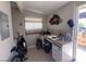 Practical kitchen setup featuring a stove, overhead cabinet, and backyard access at 304 S Crestline Dr, Las Vegas, NV 89107