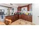 This kitchen boasts ample dark wood cabinetry, tile floors and stainless appliances at 304 S Crestline Dr, Las Vegas, NV 89107