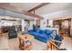Bright living room boasts an open concept, blue couch and tile flooring at 304 S Crestline Dr, Las Vegas, NV 89107