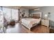 Bright main bedroom offering wood floors, large window, and a comfy bed at 304 S Crestline Dr, Las Vegas, NV 89107