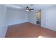 Large bedroom featuring laminate floors, ceiling fan, and neutral color palette at 3667 Descanso St, Las Vegas, NV 89121