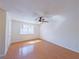 Spacious bedroom with wood laminate flooring and large window that brings in natural light at 3667 Descanso St, Las Vegas, NV 89121