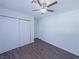 Bedroom with a ceiling fan, closet and laminate floors at 3667 Descanso St, Las Vegas, NV 89121