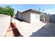 The home's exterior features a paver patio and gated access to the backyard pool at 3667 Descanso St, Las Vegas, NV 89121