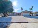 Charming single-story home with a low-maintenance gravel front yard, desert landscaping and attached garage at 3667 Descanso St, Las Vegas, NV 89121