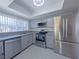 Updated kitchen features stainless steel appliances, gray cabinets, and lots of natural light at 3667 Descanso St, Las Vegas, NV 89121