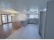 Open concept kitchen and dining area with gray cabinets, stainless steel appliances, and tile flooring at 3667 Descanso St, Las Vegas, NV 89121