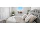 Comfortable bedroom with a plush headboard and cozy decorative pillows at 3915 Wesvan Ct, Las Vegas, NV 89121