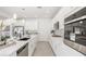 Bright kitchen featuring white cabinets, modern appliances, and ample counter space at 3915 Wesvan Ct, Las Vegas, NV 89121