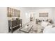Open-concept living room with stylish furniture, artwork, and a seamless flow to other areas at 3915 Wesvan Ct, Las Vegas, NV 89121