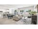 Open-concept living space with a kitchen, dining area, and comfortable seating for entertaining at 3915 Wesvan Ct, Las Vegas, NV 89121