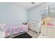 Bright bedroom with carpeting, a window, a twin-sized bed, and white furniture at 4014 Sparrow Rock St, Las Vegas, NV 89129