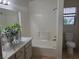 Bathroom with white vanity, tiled shower, and separate soaking tub at 4356 Pittsfield St, Las Vegas, NV 89115
