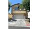 Two-story home with stucco siding and a two-car garage at 4356 Pittsfield St, Las Vegas, NV 89115