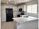 Well-lit kitchen with stainless steel appliances and tile floors at 4356 Pittsfield St, Las Vegas, NV 89115