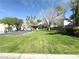 View of the community with grass and trees and residential buildings at 4356 Pittsfield St, Las Vegas, NV 89115