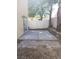 A small cement patio in the backyard of the home with a privacy fence at 4356 Pittsfield St, Las Vegas, NV 89115