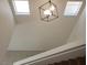 A staircase featuring an elegant hanging pendant light fixture and skylights at 4356 Pittsfield St, Las Vegas, NV 89115