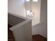 A staircase featuring an elegant hanging pendant light fixture at 4356 Pittsfield St, Las Vegas, NV 89115