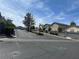 Residential street featuring well-kept homes and landscaping in a suburban neighborhood at 4356 Pittsfield St, Las Vegas, NV 89115