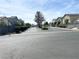 A tranquil street view of well-maintained homes, green lawns, and tidy landscaping under a bright sunny sky at 4356 Pittsfield St, Las Vegas, NV 89115