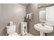 Charming powder room features pedestal sink, white cabinet, and neutral wall color at 4573 Milvio Ave, Las Vegas, NV 89141