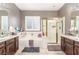 Spacious bathroom featuring soaking tub, walk-in shower, and double vanity sinks at 4573 Milvio Ave, Las Vegas, NV 89141