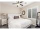 This bedroom features a ceiling fan, ensuite bathroom, and lots of natural light at 4573 Milvio Ave, Las Vegas, NV 89141