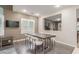 A dining area featuring hardwood floors and a pass-through to another living space at 4573 Milvio Ave, Las Vegas, NV 89141