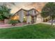 Beautiful two-story home with manicured lawn, desert landscaping, and a welcoming entrance at 4573 Milvio Ave, Las Vegas, NV 89141
