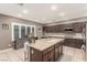Well-appointed kitchen with a large island, stainless steel appliances, and ample cabinet space at 4573 Milvio Ave, Las Vegas, NV 89141