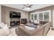 Cozy living room features a fireplace, plush seating, and a relaxing atmosphere at 4573 Milvio Ave, Las Vegas, NV 89141