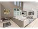 Spacious living room features soaring ceilings, abundant natural light, and stylish neutral decor at 4573 Milvio Ave, Las Vegas, NV 89141