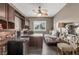 Office space with a ceiling fan, desk, cabinets, and gray hardwood floors at 4573 Milvio Ave, Las Vegas, NV 89141