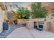 Outdoor kitchen with built-in grill, counter space, and room for food preparation at 4573 Milvio Ave, Las Vegas, NV 89141
