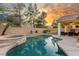 Beautiful in-ground pool with adjacent hot tub at 4573 Milvio Ave, Las Vegas, NV 89141