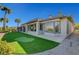 Backyard with artificial grass putting green and desert landscaping at 4574 Fiore Bella Blvd, Las Vegas, NV 89135