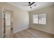 The bedroom features light wood floors, a ceiling fan, and an ensuite bathroom at 4574 Fiore Bella Blvd, Las Vegas, NV 89135