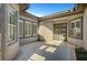 Enclosed front courtyard with double doors, large windows, and tile flooring at 4574 Fiore Bella Blvd, Las Vegas, NV 89135