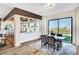 Contemporary dining area featuring modern light fixture, sleek table, and picturesque window views at 4574 Fiore Bella Blvd, Las Vegas, NV 89135