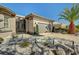 Well landscaped single story home with desert landscaping, gated entry and a two car garage at 4574 Fiore Bella Blvd, Las Vegas, NV 89135