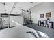 Spacious garage with ample storage cabinets and epoxy flooring, perfect for organization and functionality at 4574 Fiore Bella Blvd, Las Vegas, NV 89135
