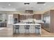Modern kitchen with an island, stainless steel appliances, and breakfast bar seating at 4574 Fiore Bella Blvd, Las Vegas, NV 89135