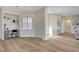 Open-concept living area showcasing built-in shelves, a workstation, and light wood flooring at 4574 Fiore Bella Blvd, Las Vegas, NV 89135