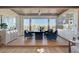 Bright office featuring wood floors, custom shelves and cabinets, and a large window overlooking a backyard at 4574 Fiore Bella Blvd, Las Vegas, NV 89135