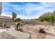 Wide backyard featuring patio seating, mature trees, and landscaping potential for entertainment at 4919 Rancho Domingo Ct, North Las Vegas, NV 89031