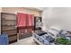 Cozy bedroom featuring carpet floors, natural light, and functional storage solutions at 4919 Rancho Domingo Ct, North Las Vegas, NV 89031