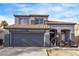 Charming two-story home with a two-car garage and a well-maintained exterior, perfect for families or first-time buyers at 4919 Rancho Domingo Ct, North Las Vegas, NV 89031